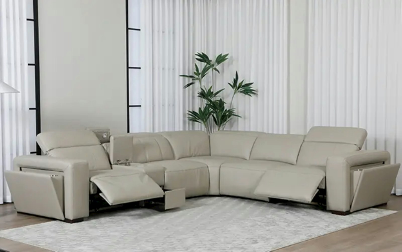 A beige sectional sofa is in a modern living room.